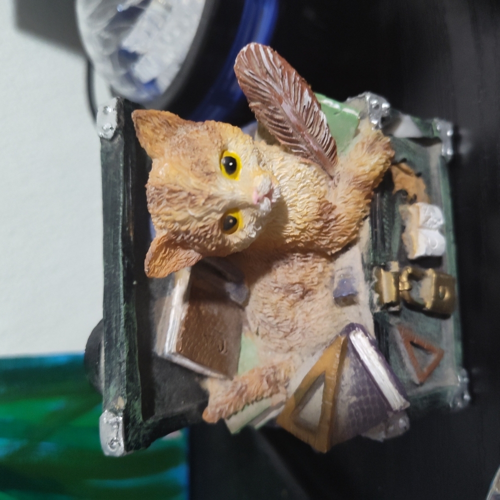 Adorable Cat Figurine with Books
